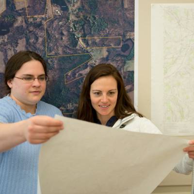 students viewing a large format map